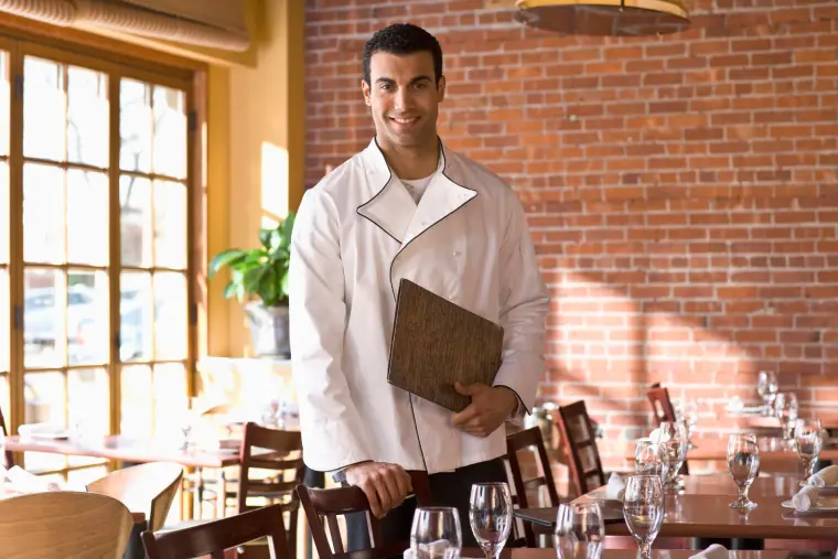 Chef in a white uniform in a restaurant