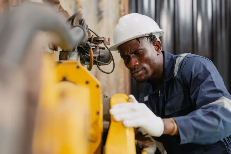 Operator working on a machine in a factory